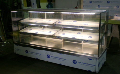 Three-tier heated display cabinet on wheels in the workshop