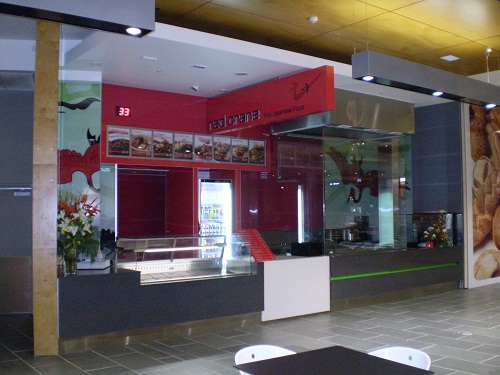 Shopfront servery with stainless counters and display