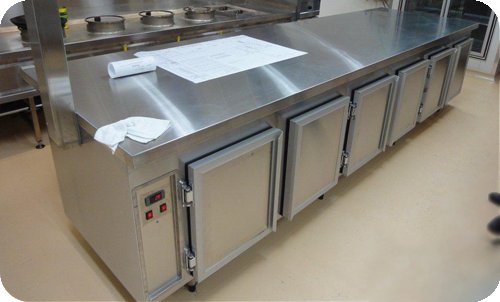 Stainless under-bench refrigerated cabinet with five aluminium-framed doors